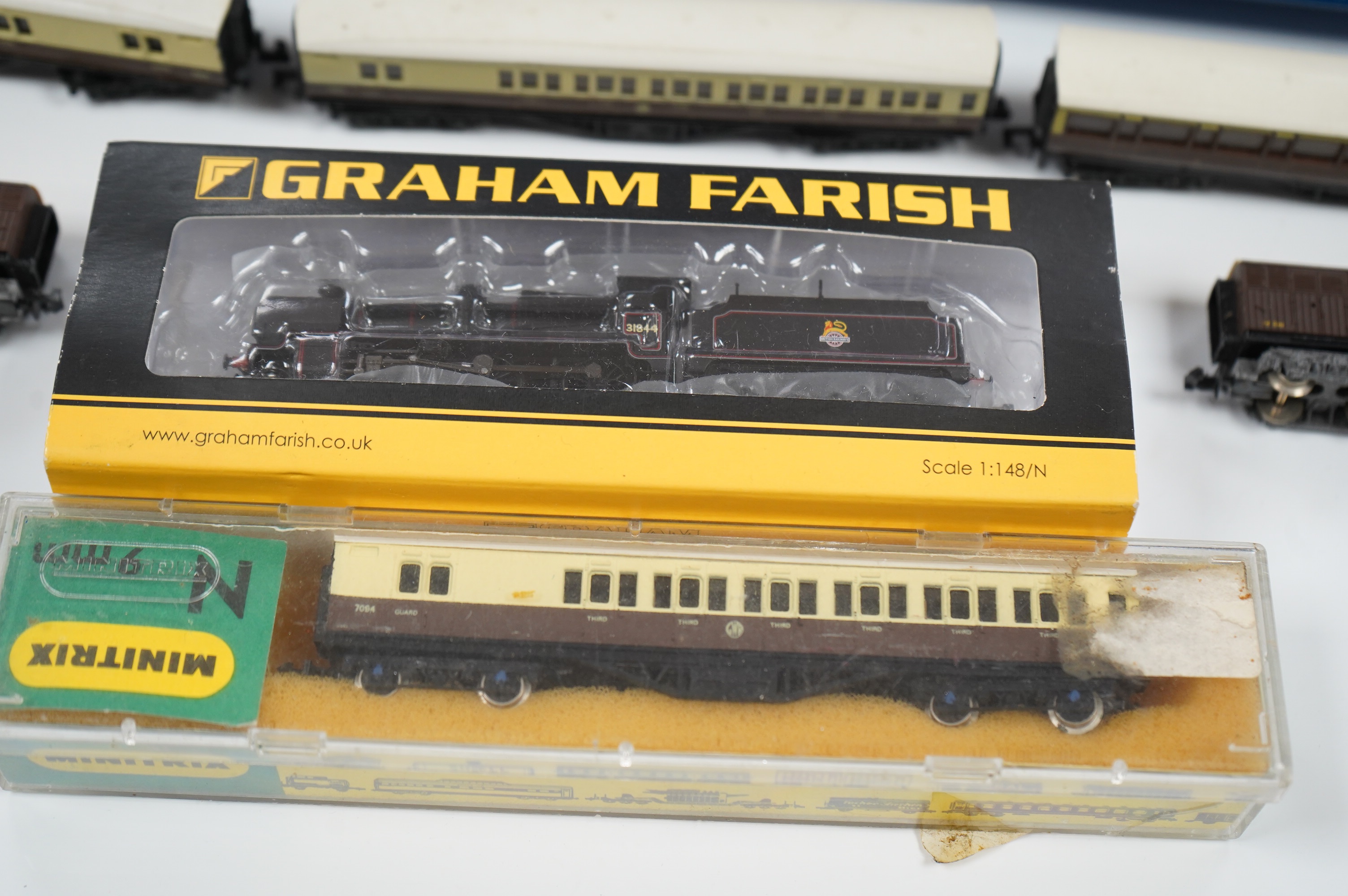 Eleven N gauge railway items by Dapol and Graham Farish; a BR N Class 2-6-0 locomotive, 31844, six GWR bogie coaches, two Siphon H wagons and two Siphon G wagons. Condition - good, five items boxed.